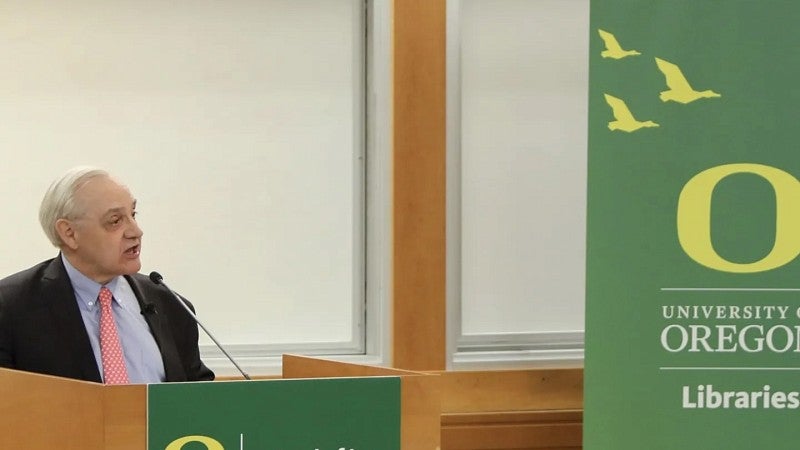 E.J. Dionne stands at a podium